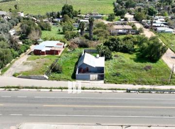 e3b3a39bff30862c1ea3b8dc35fd4018664ae07ea507be3b11cb5f994770f510 · Terreno Frente a Carretera Federal en Valle de Guadalupe