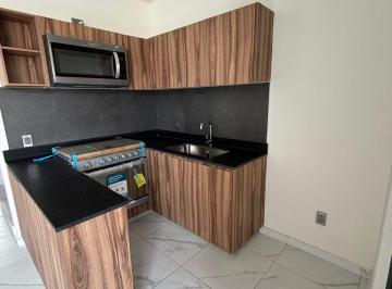 Cocina equipada con estufa y horno de microondas · Departamento Nuevo en Parques de Tesistán