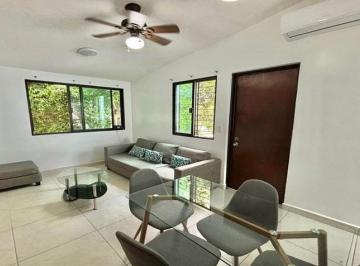 una sala y un comedor en anemonas playacar · Departamento en Renta en Anemonas Playacar | 2 Recámaras, Amueblado y Equipado