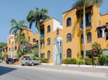 una fachada externa de un edificio de departamentos en hacienda del carmen playa del carmen · Departamento en Renta en El Centro de Playa del Carmen | 1 Recamara en Hacienda del Carmen