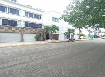una fachada exterior con locales y departamentos en venta en xharm playa del carmen · Edificio en Venta Para Inversión con Alta Rentabilidad – Playa del Carmen