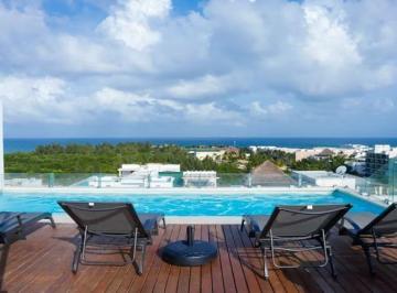 una terraza comun con camastros en dk 52 playa del carmen · Departamento Amueblado en Renta de 1 Recámara – Dk52 Playa del Carmen