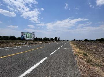 65f84620310515573b62974a1cb91da31462c95f834580c970712114721c7e27 · Terreno a Pie de Carretera Cerca de Aeropuerto Morelia – Ideal Para Logística