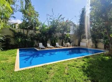 una piscina con camastros en ocean blue playa del carmen · Penthouse en Venta 3 Recamaras Ocean Blue Condos – Playa Xcalacoco, Playa del Carmen