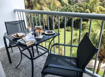 balcón con vista a jardines · Depto 2 Recamaras 2 Baños Condominio Mayan Lakes con Club de Playa y Casa Clu