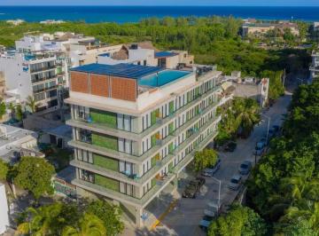 una vista aerea de un edificio en macondo 5th playa del carmen · Departamento de 1 Recámara en Renta | Macondo 5th Av Playa del Carmen | a Pasos de La Playa