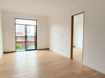 Estancia vista desde la puerta principal. · Departamento en Venta con Roof Privado