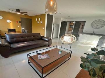 un sofa y un comedor en condominio anemonas playacar · Departamento 2 Recamaras en Renta en Playa del Carmen Playacar | Condominio Anemonas