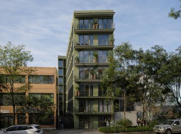 Edificio moderno en una calle arbolada.png · Departamento en Venta en Roma Norte