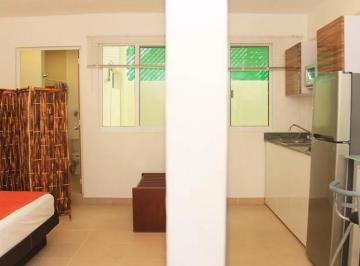 una recamara y una barra desayunadora en xell suites playa del carmen · Estudio Amueblado en Renta | Colosio Playa del Carmen | Cerca de La Playa y 5ta Av