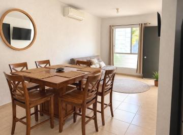 Comedor y sala al fondo · Casa de 3 Rec en Renta en Palmas 2, Playa del Carmen