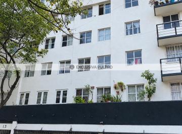 Fachada blanca entre árboles y balcones.png · Departamento en Venta en Modelo Pensil