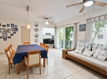 Cocina la fondo, balcón, comedor y sofá · Departamento en Renta de 3 Recámaras en Privada con Alberca | Playa del Carmen