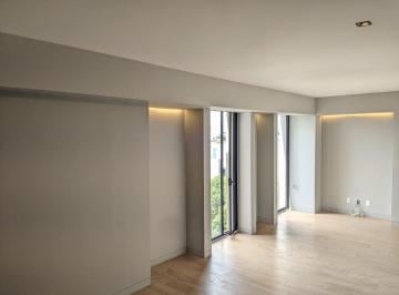 Área de estar frente a la cocina · Roma Norte: Departamento Iluminado de 74 m², Bien Orientado con Vigilancia 24/7