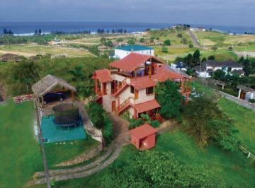 Casa de 4 habitaciones, Santa Elena · Inversión en Olón: Casa Amoblada con Vista Al Mar y Alta Rentabilidad